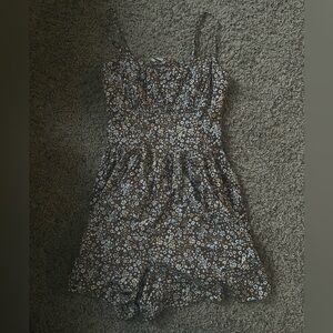 Brown floral romper from Hollister. Size small. Back cutout